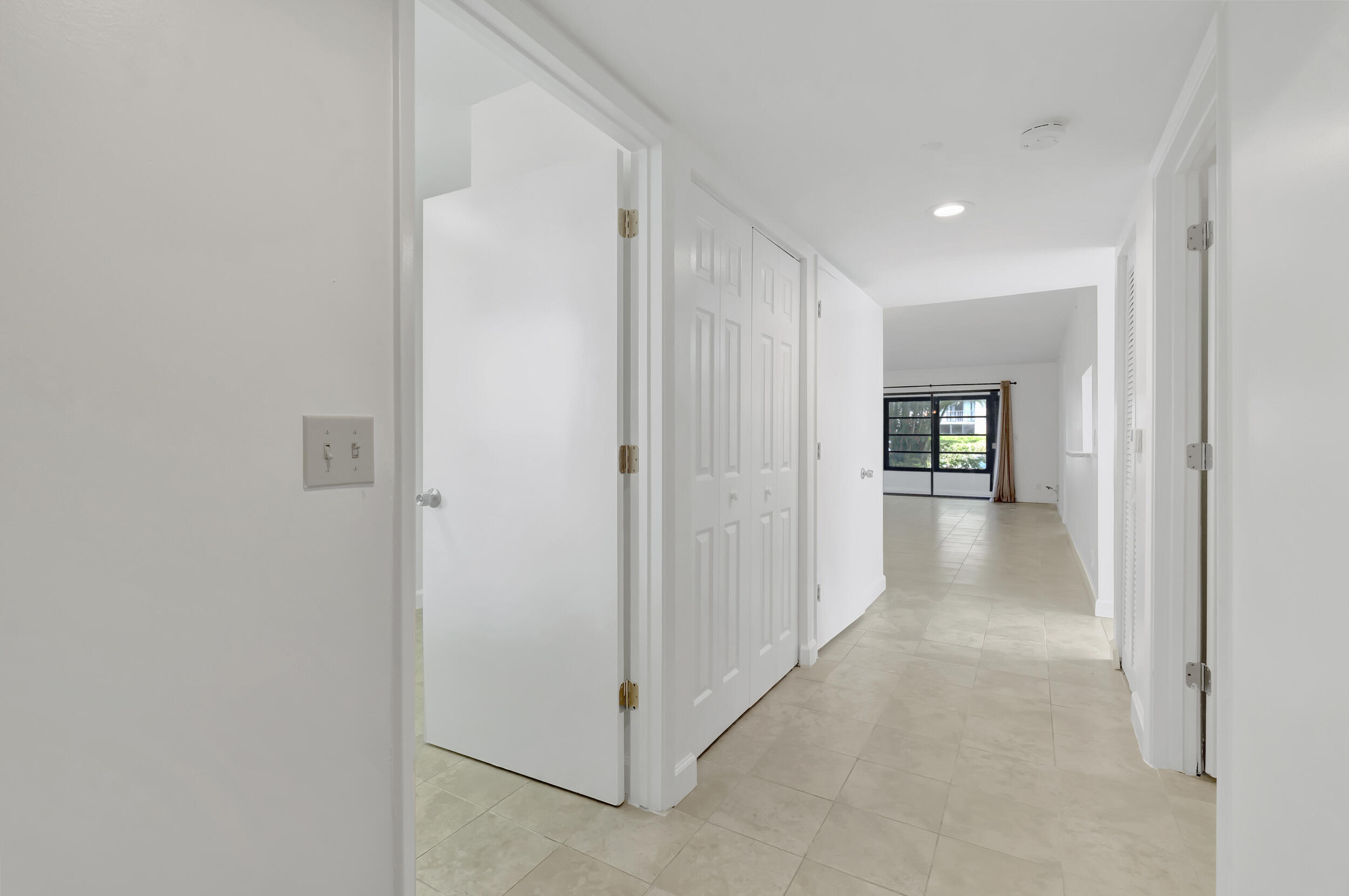 15364 Lakes Of Delray Boulevard, Unit 45 Delray Beach, FL 33484 - Photo 18 of 56 a view of a hallway with wooden shelves