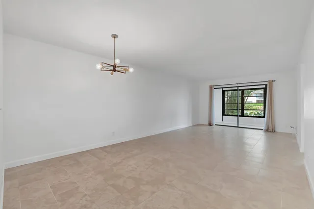 a view of a room with windows and cabinet
