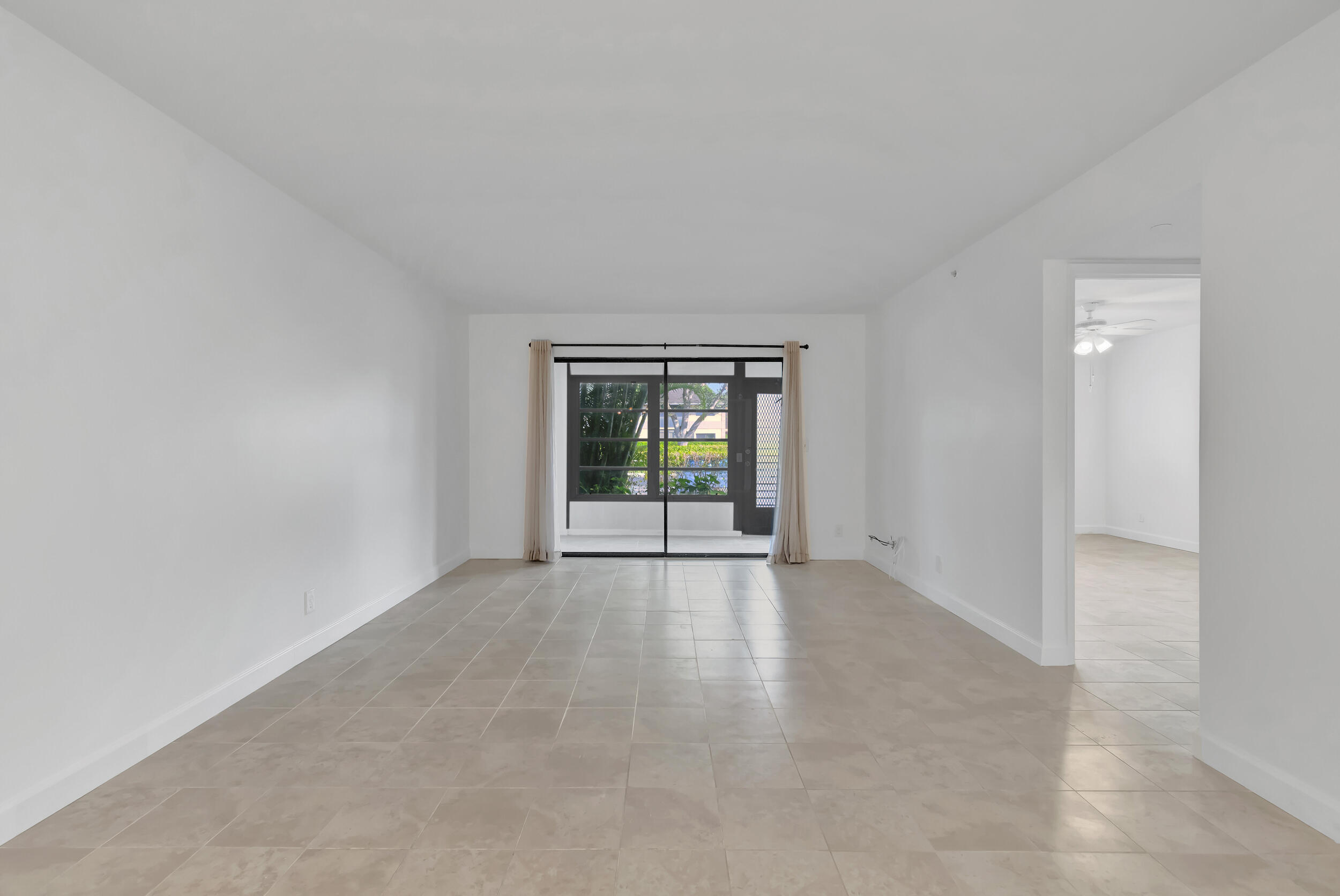 15364 Lakes Of Delray Boulevard, Unit 45 Delray Beach, FL 33484 - Photo 21 of 56 a view of an empty room with window