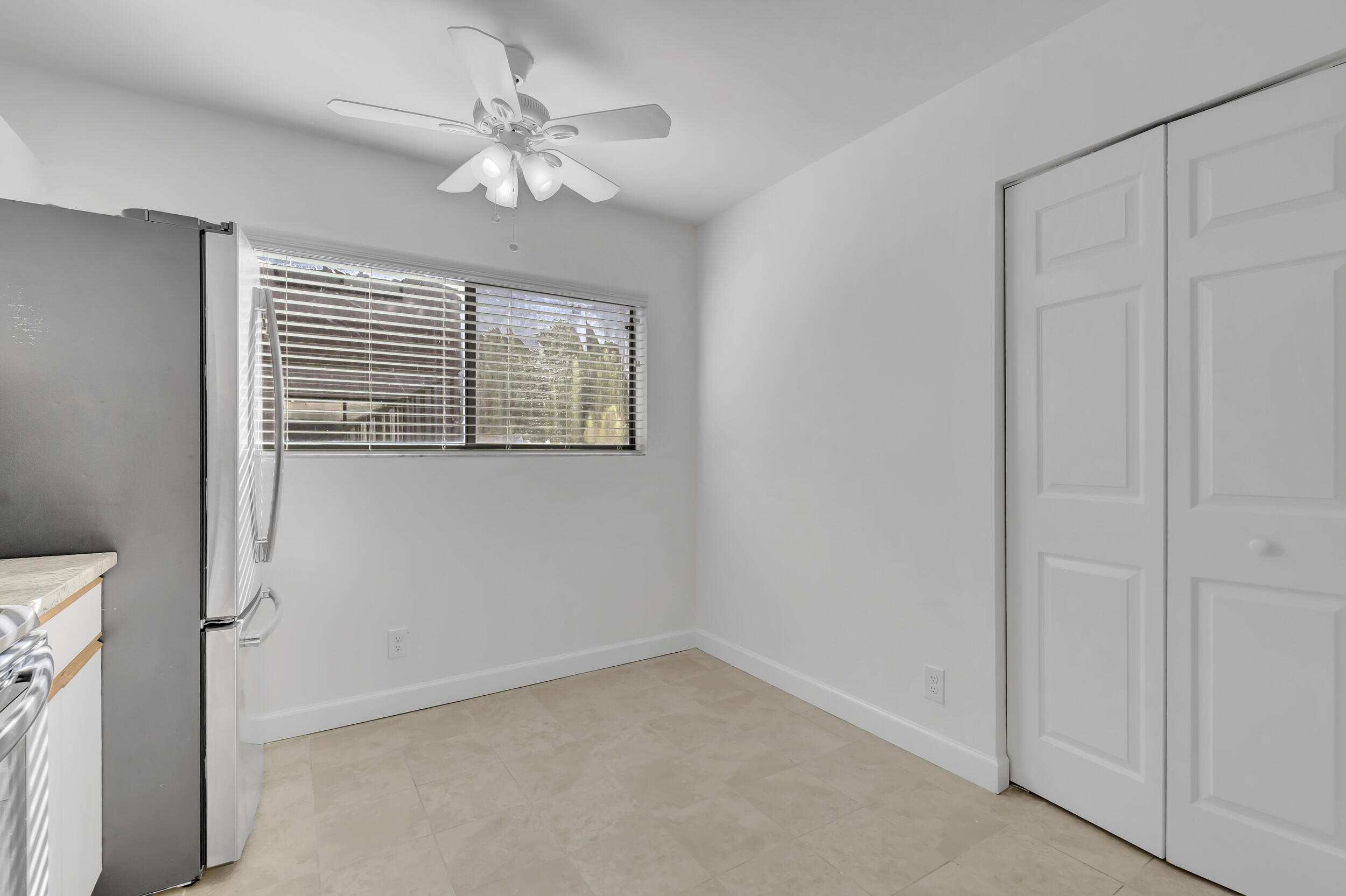 15364 Lakes Of Delray Boulevard, Unit 45 Delray Beach, FL 33484 - Photo 28 of 56 a view of an empty room with a window
