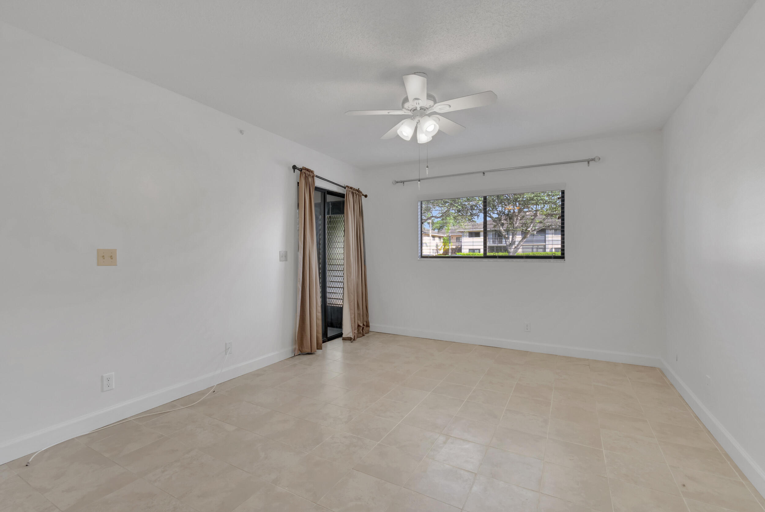 15364 Lakes Of Delray Boulevard, Unit 45 Delray Beach, FL 33484 - Photo 31 of 56 a view of an empty room with a window