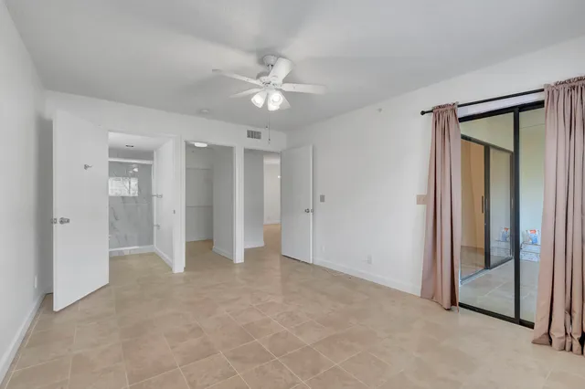 a bathroom with a shower sink vanity mirror and toilet