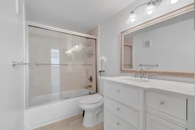 a view of a room with a large window with the outdoor space