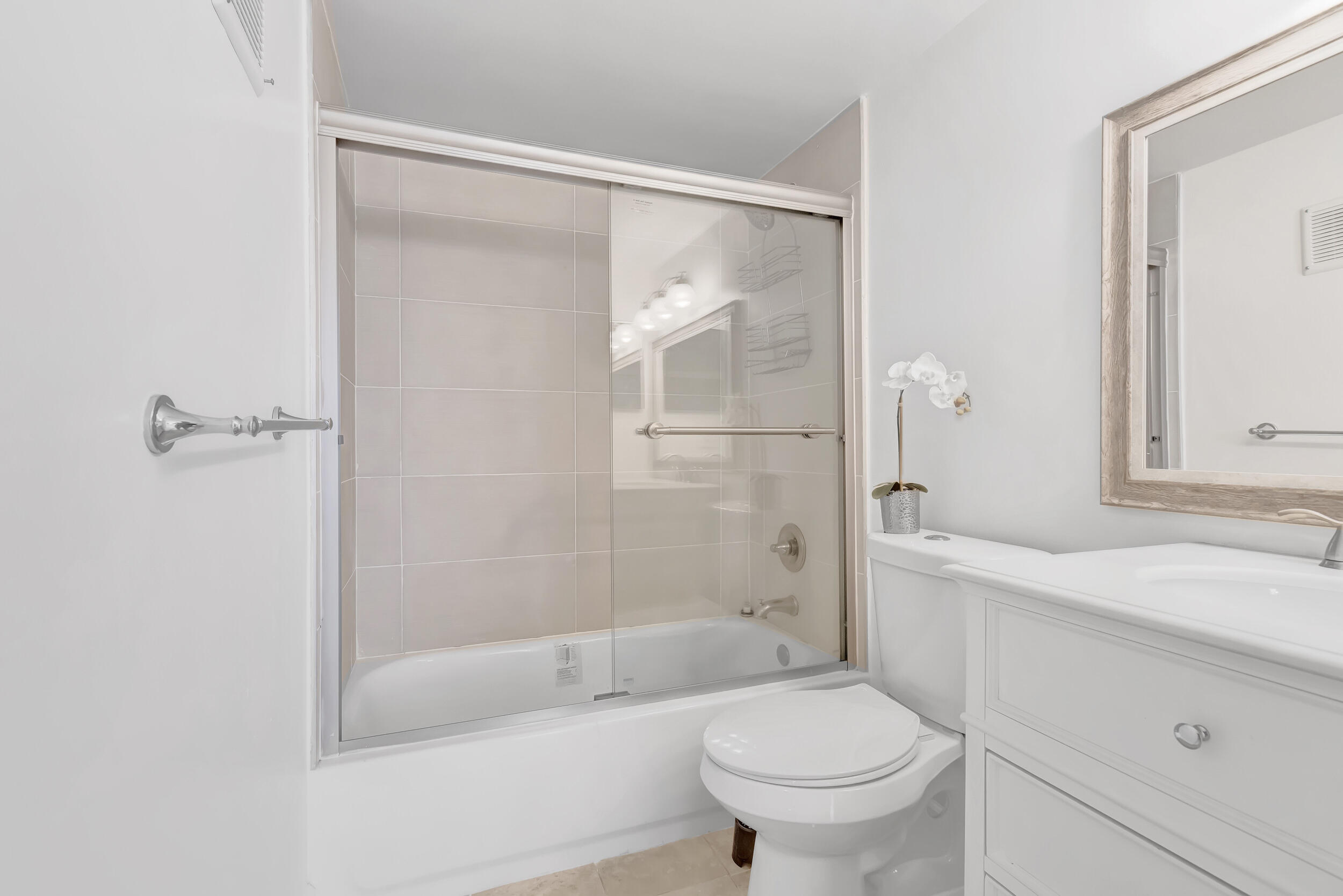 15364 Lakes Of Delray Boulevard, Unit 45 Delray Beach, FL 33484 - Photo 39 of 56 a bathroom with a sink toilet and shower