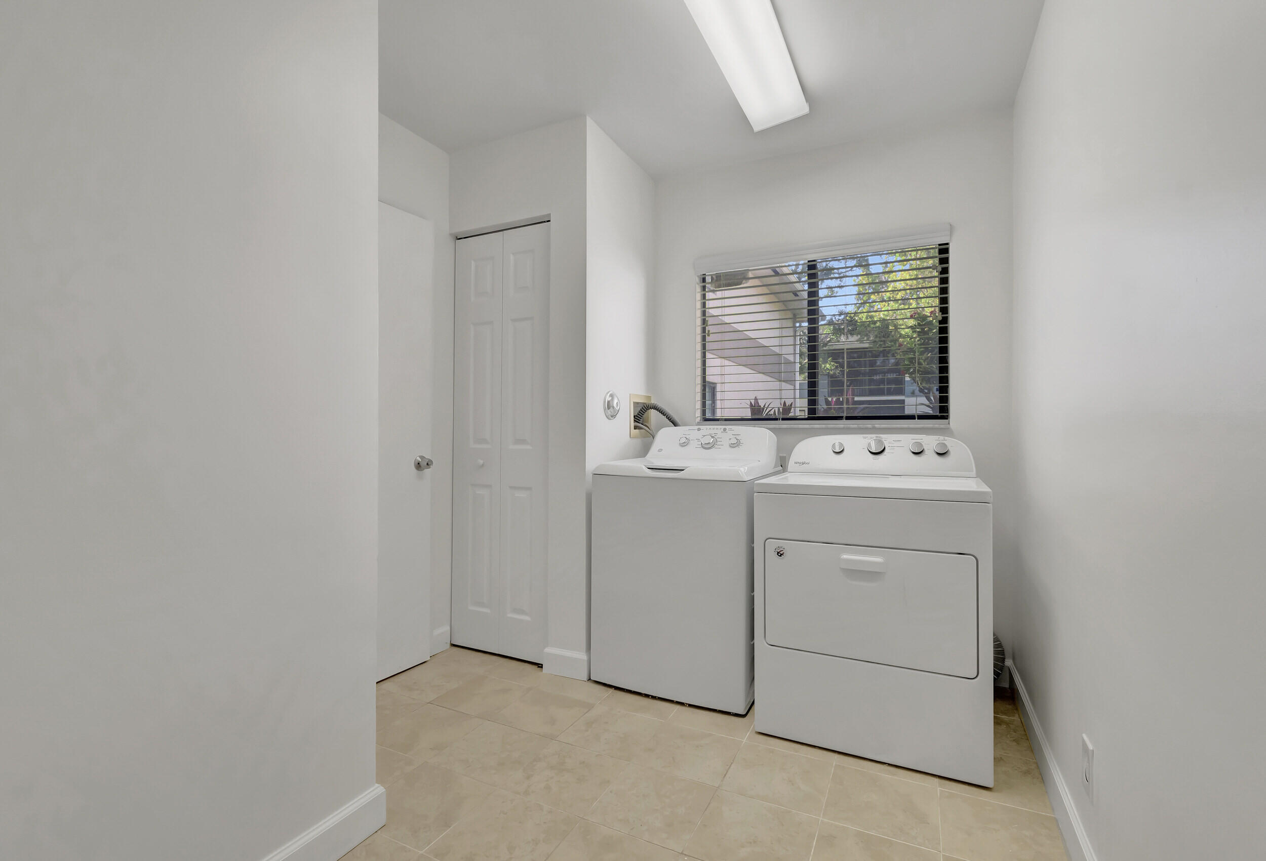 15364 Lakes Of Delray Boulevard, Unit 45 Delray Beach, FL 33484 - Photo 40 of 56 a room with dryer and washer