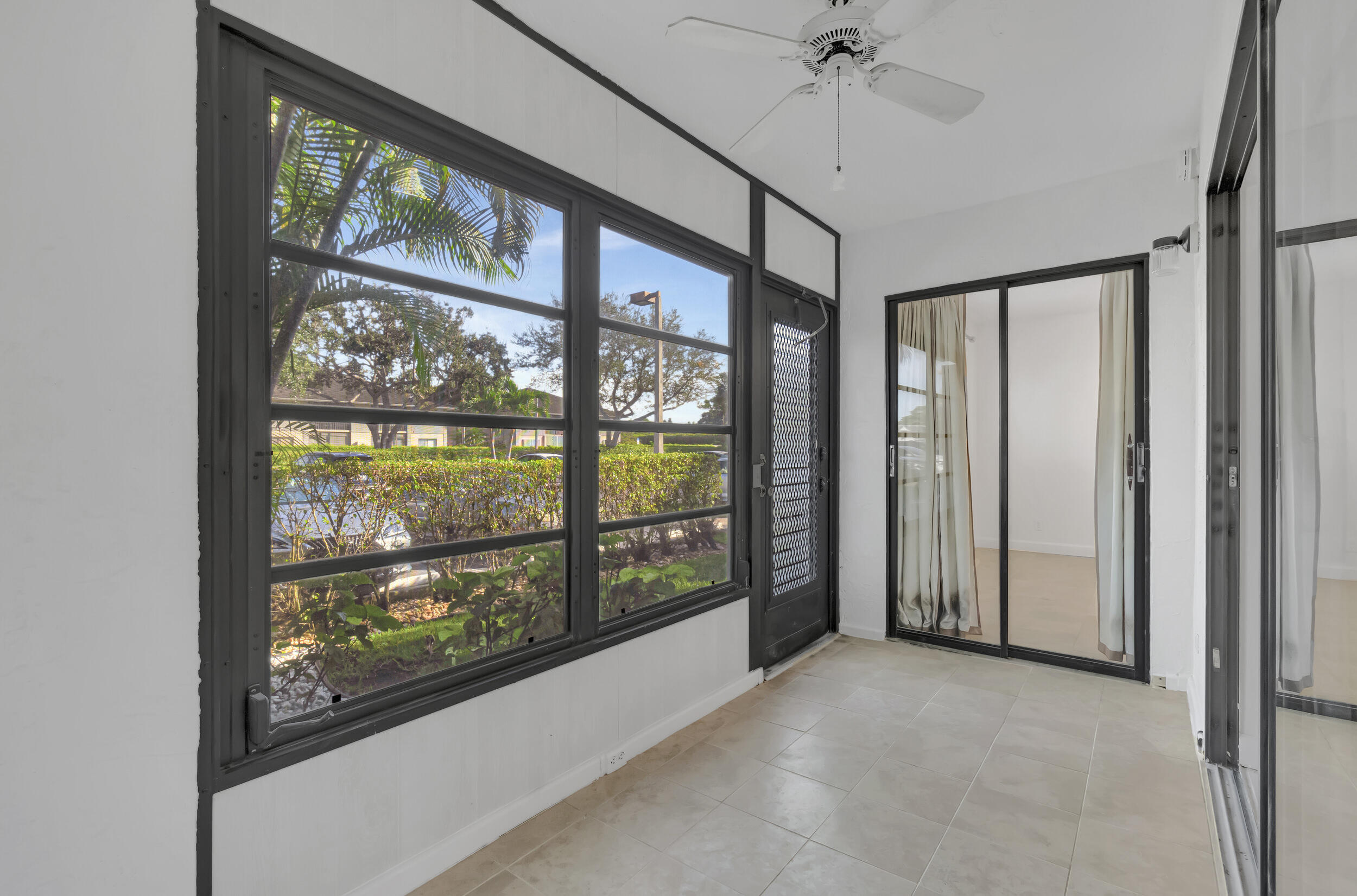 15364 Lakes Of Delray Boulevard, Unit 45 Delray Beach, FL 33484 - Photo 41 of 56 a view of a room with a large window with the outdoor space