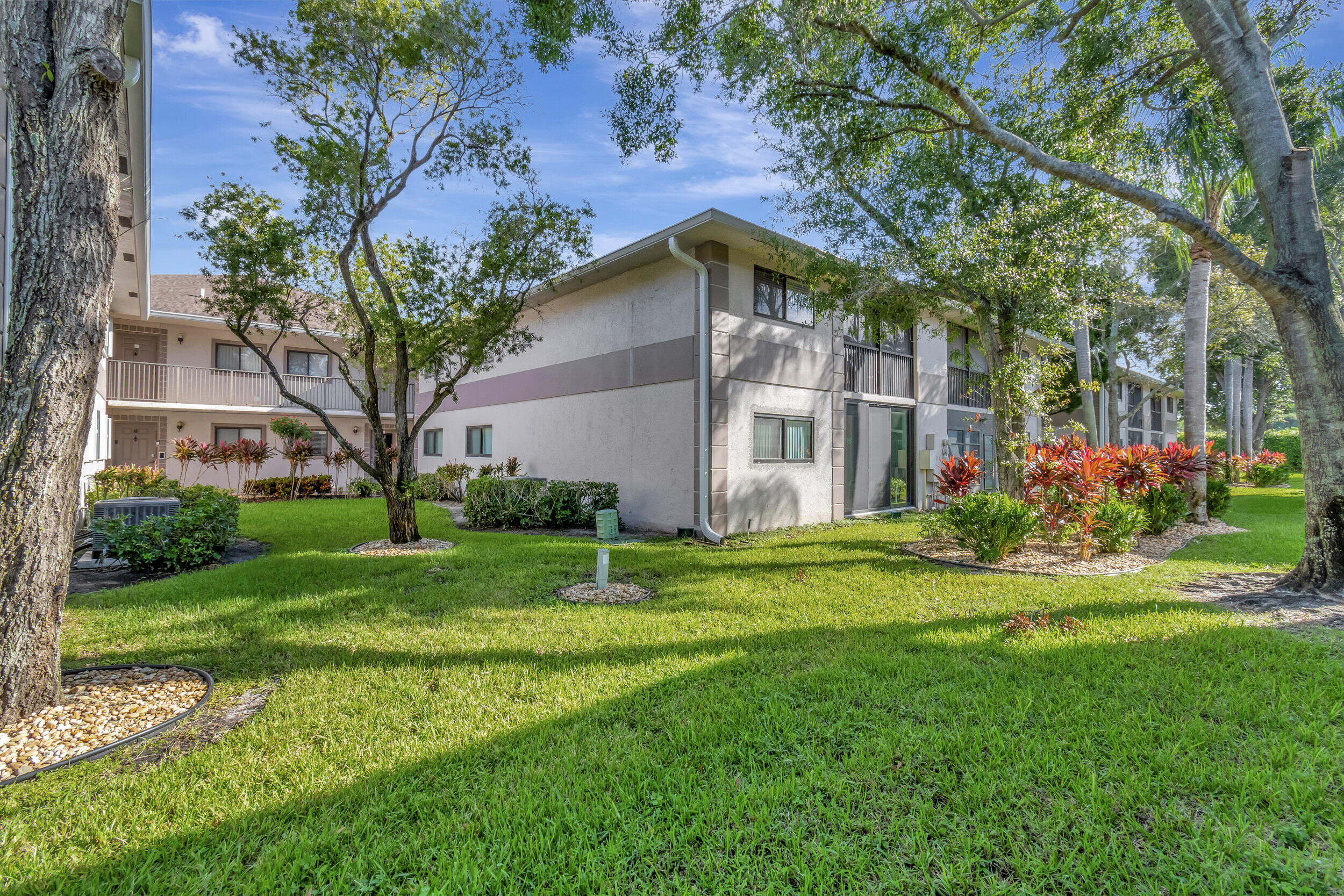15364 Lakes Of Delray Boulevard, Unit 45 Delray Beach, FL 33484 - Photo 45 of 56 a front view of house with yard and green space