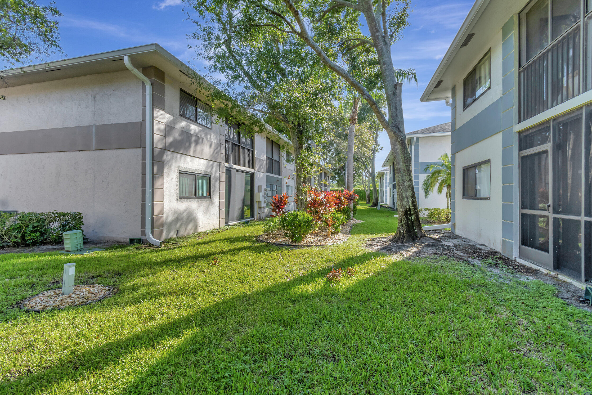 15364 Lakes Of Delray Boulevard, Unit 45 Delray Beach, FL 33484 - Photo 46 of 56 a view of a house with a yard and plants