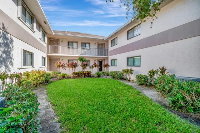 a aerial view of a house with a yard and plants