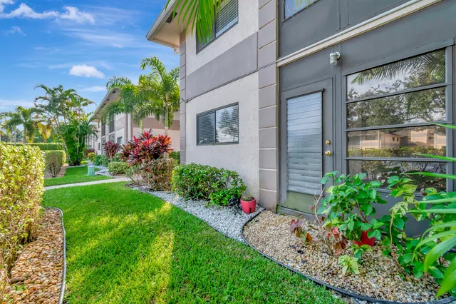 a view of a garden with a lake view
