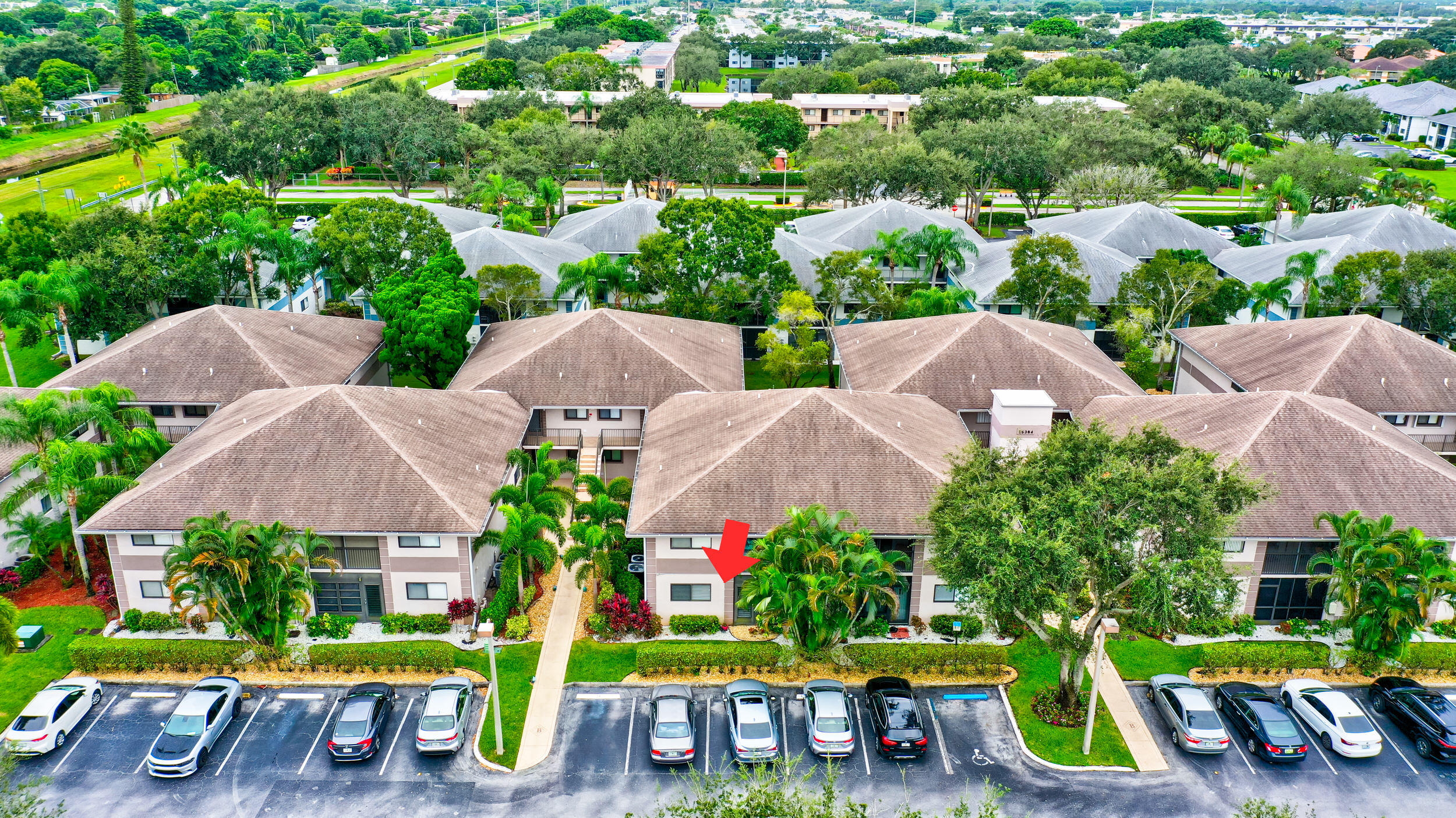 15364 Lakes Of Delray Boulevard, Unit 45 Delray Beach, FL 33484 - Photo 53 of 56 an aerial view of multiple houses with yard