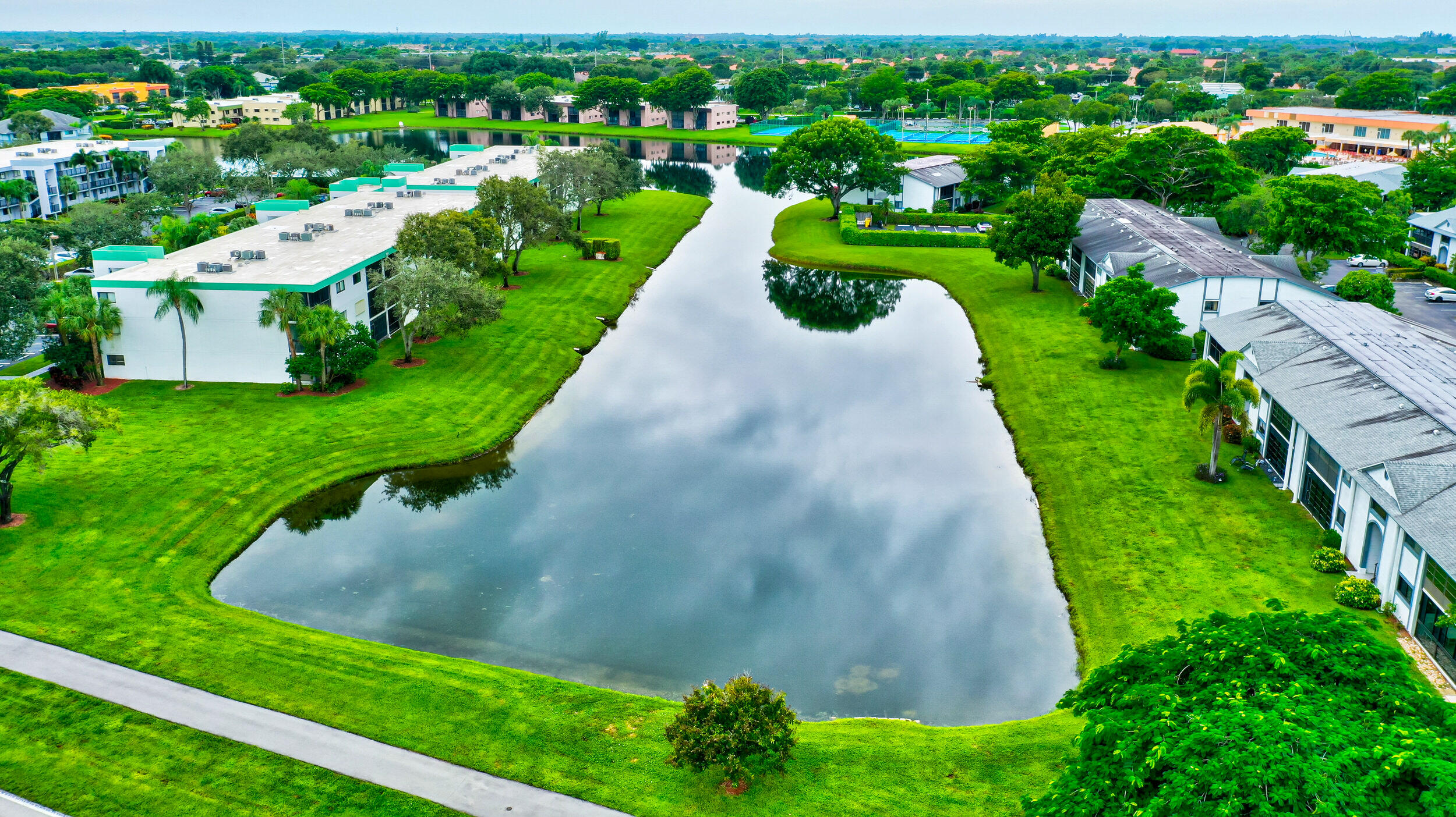 15364 Lakes Of Delray Boulevard, Unit 45 Delray Beach, FL 33484 - Photo 56 of 56 a view of a garden with a lake view