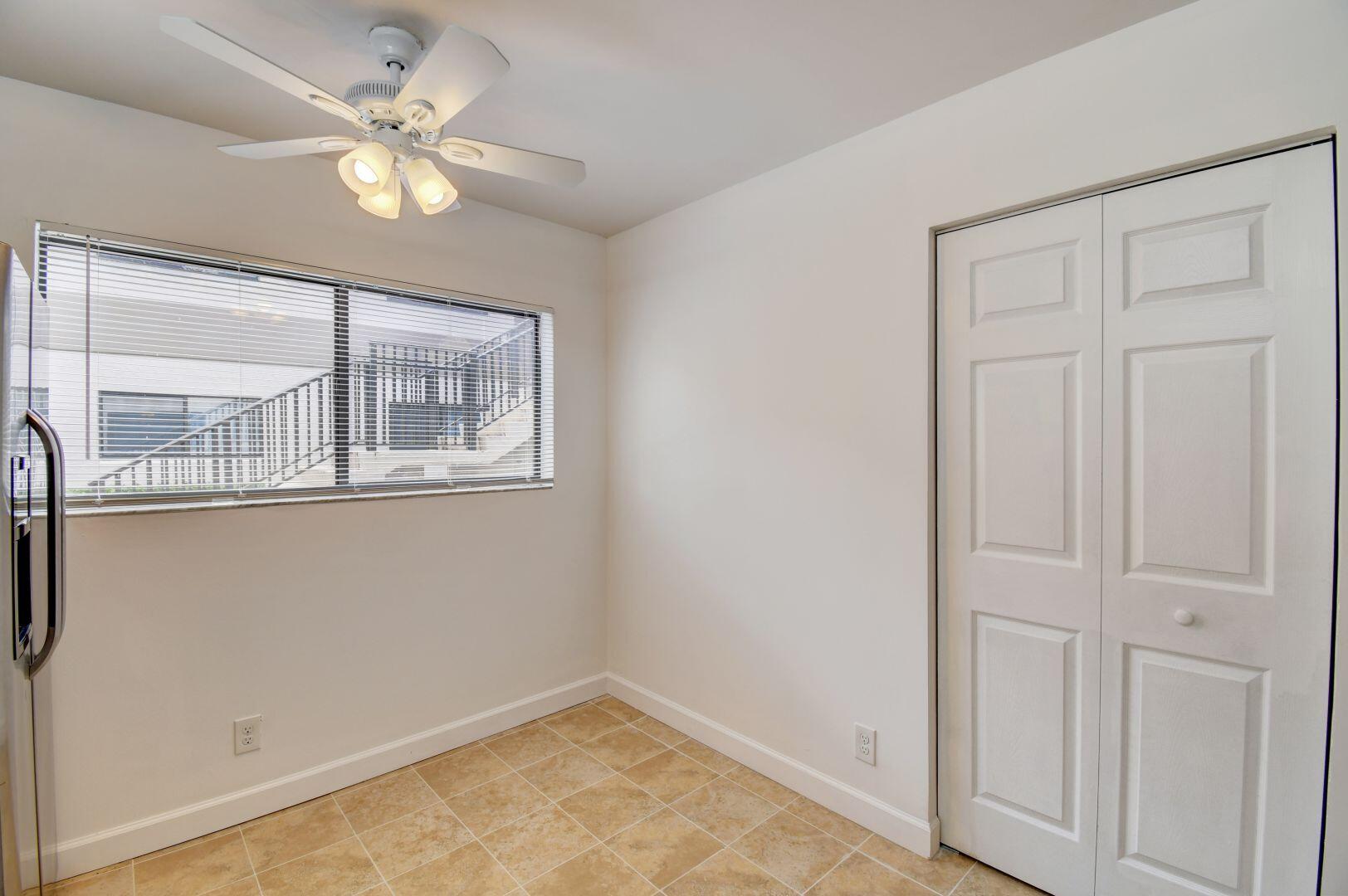 15364 Lakes Of Delray Boulevard, Unit 45 Delray Beach, FL 33484 - Photo 7 of 56 a view of a livingroom with a fan