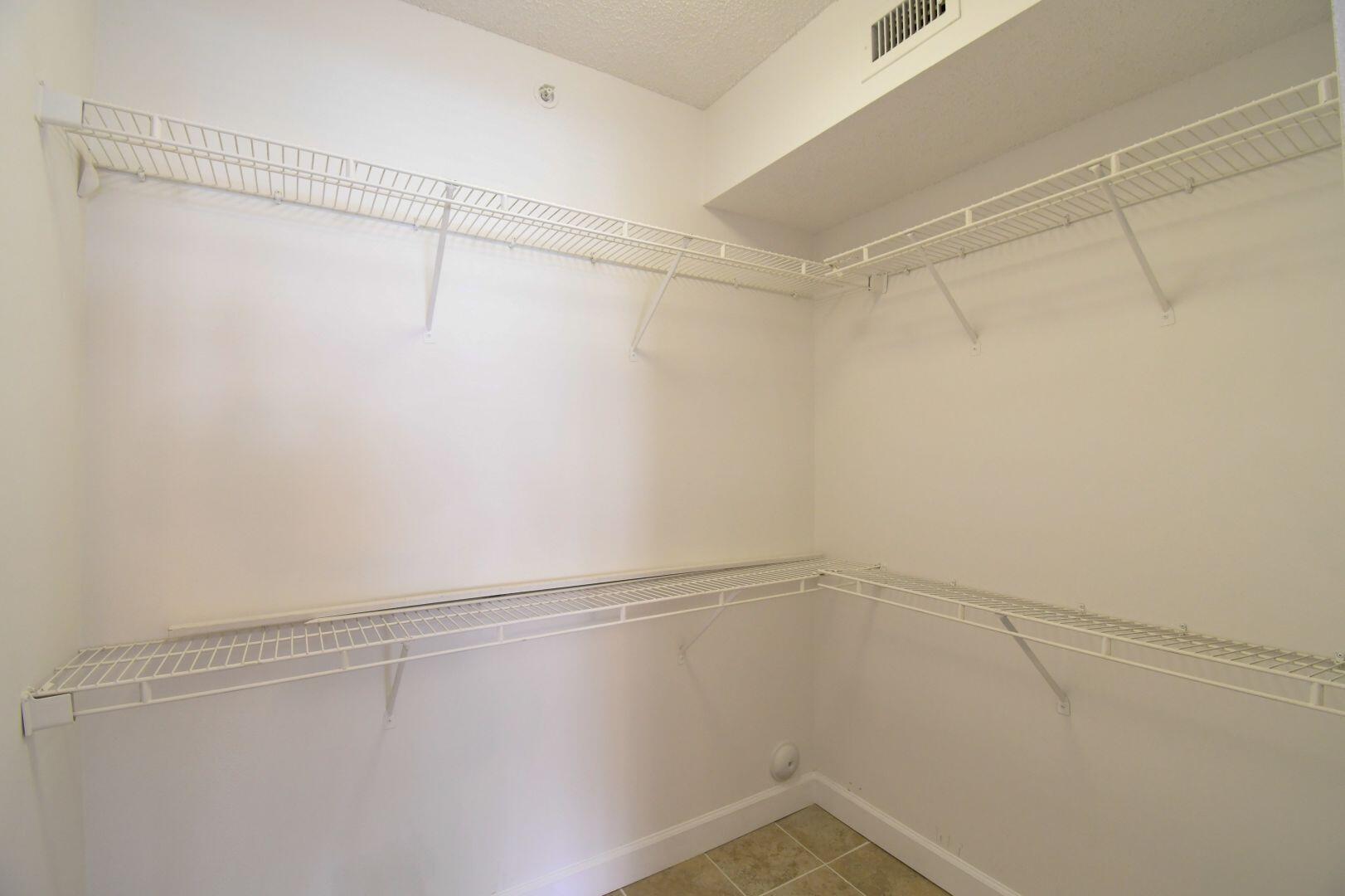 15364 Lakes Of Delray Boulevard, Unit 45 Delray Beach, FL 33484 - Photo 9 of 56 a view of a room with racks on the wall