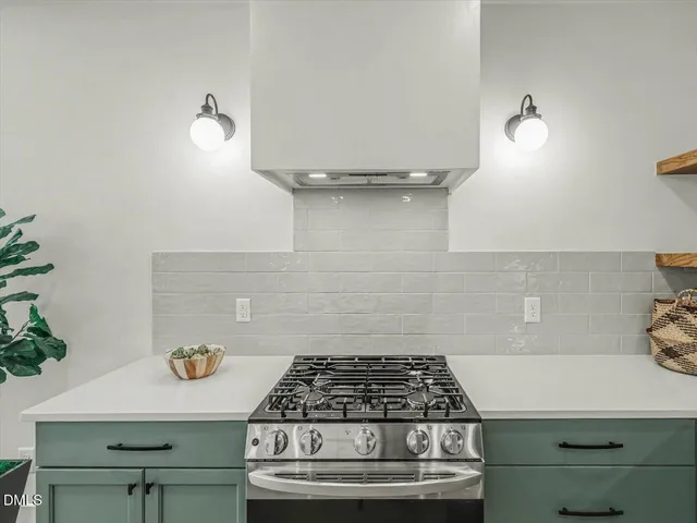 a kitchen with a sink cabinets and wooden floor