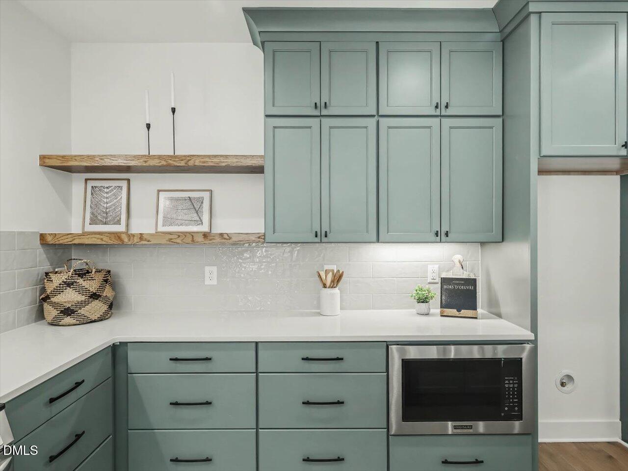 2312 Broad Street Durham, NC 27704 - Photo 14 of 53 a kitchen with stainless steel appliances granite countertop cabinets and a sink