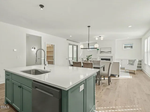 a kitchen with stainless steel appliances granite countertop cabinets and a sink