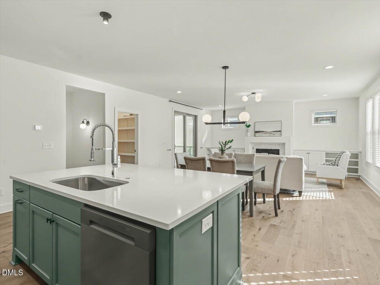 2312 Broad Street Durham, NC 27704 - Photo 15 of 53 a kitchen with center island table and chairs