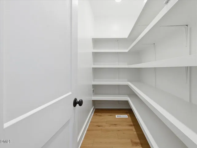 a kitchen with center island table and chairs