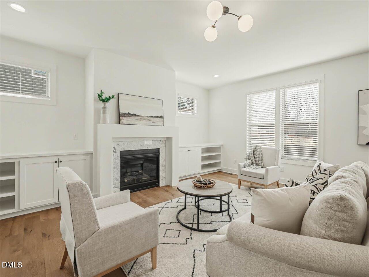 2312 Broad Street Durham, NC 27704 - Photo 20 of 53 a living room with furniture and a fireplace