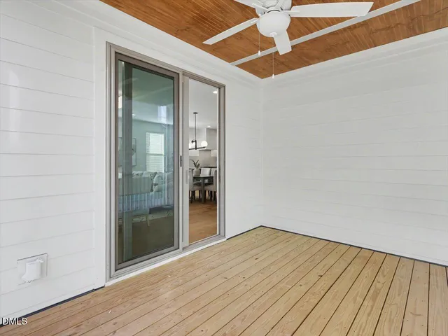 a view of porch with wooden floor