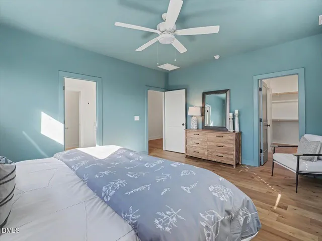 a bathroom with a double vanity sink mirror and shower