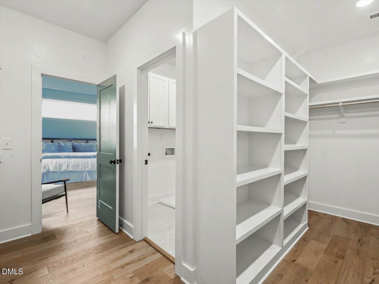 2312 Broad Street Durham, NC 27704 - Photo 36 of 53 a view of walk in closet with empty racks