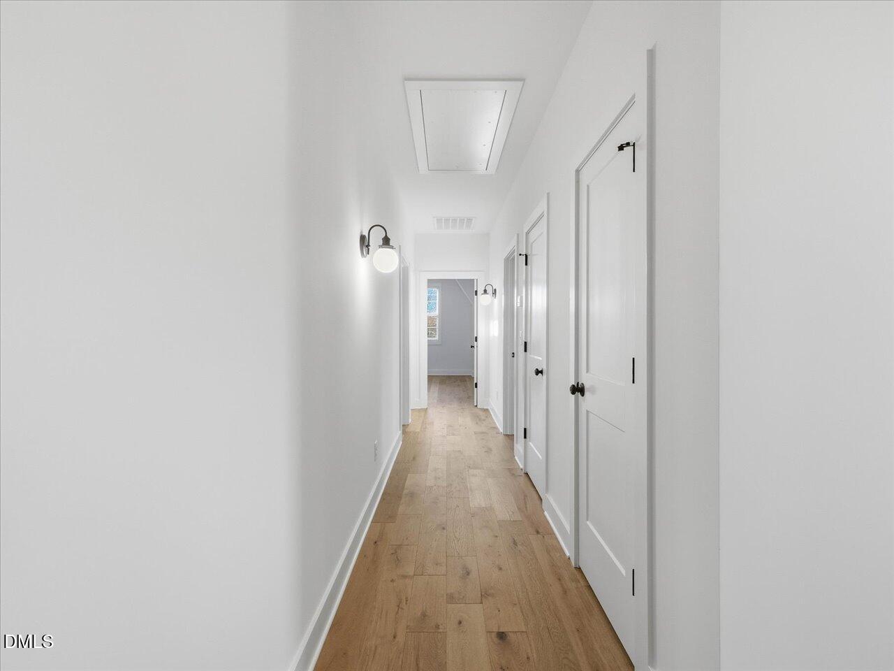 2312 Broad Street Durham, NC 27704 - Photo 40 of 53 a view of a hallway with wooden floor and closet