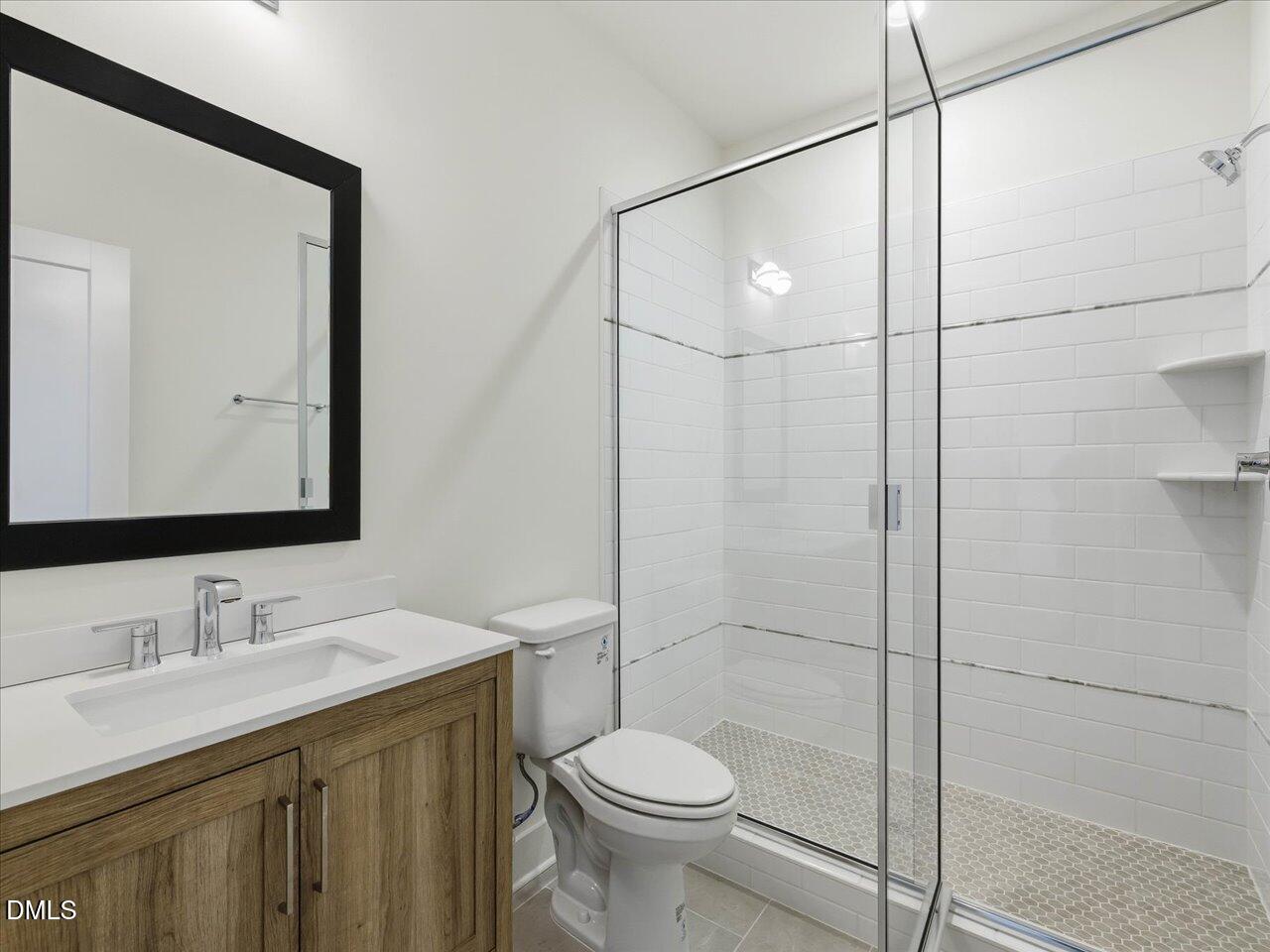 2312 Broad Street Durham, NC 27704 - Photo 44 of 53 a bathroom with a sink toilet and shower