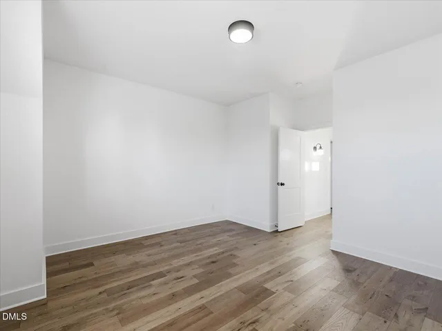 a bathroom with a double vanity sink a toilet and a tub