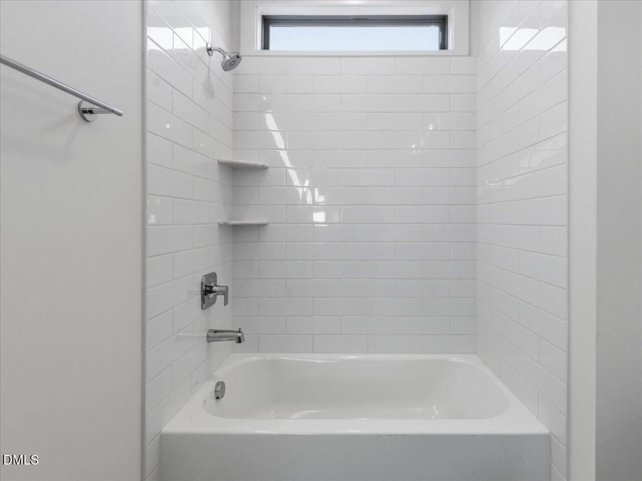 2312 Broad Street Durham, NC 27704 - Photo 49 of 53 a close up of a bathtub curtain