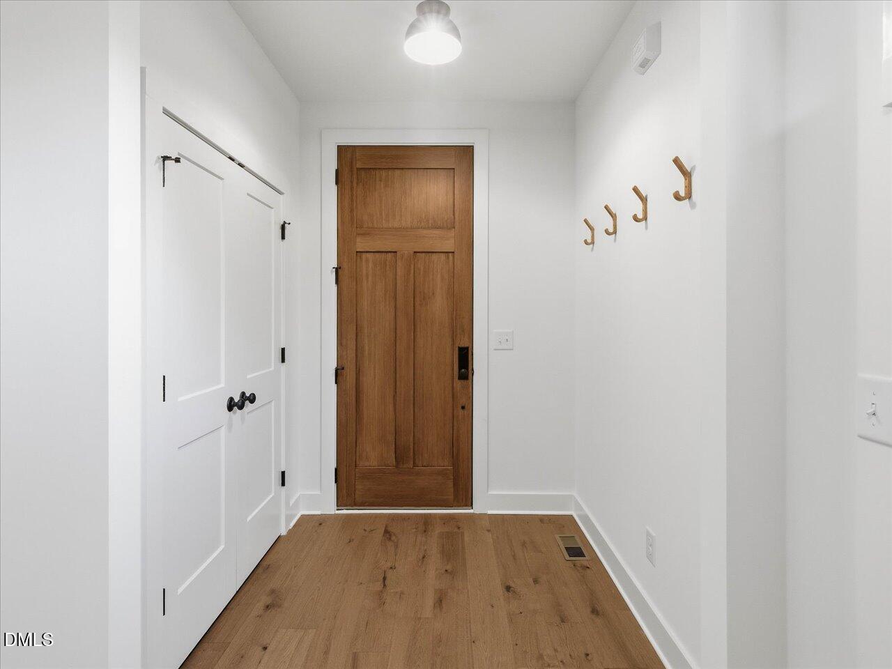 2312 Broad Street Durham, NC 27704 - Photo 5 of 53 an empty room with wooden floor and closet