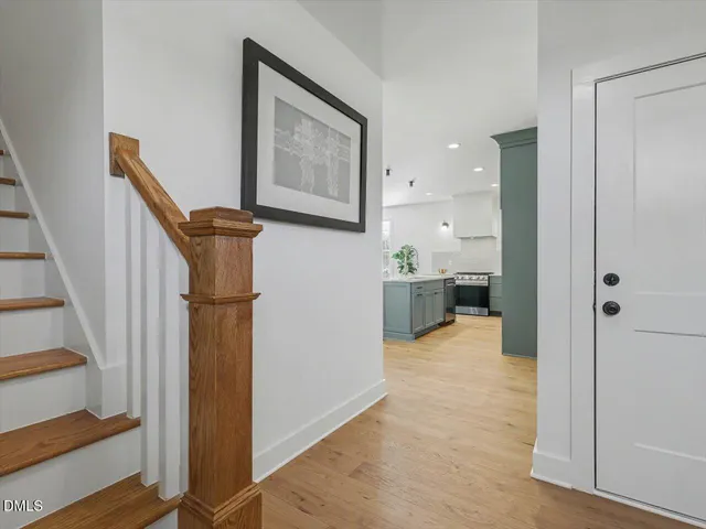 an empty room with wooden floor and closet