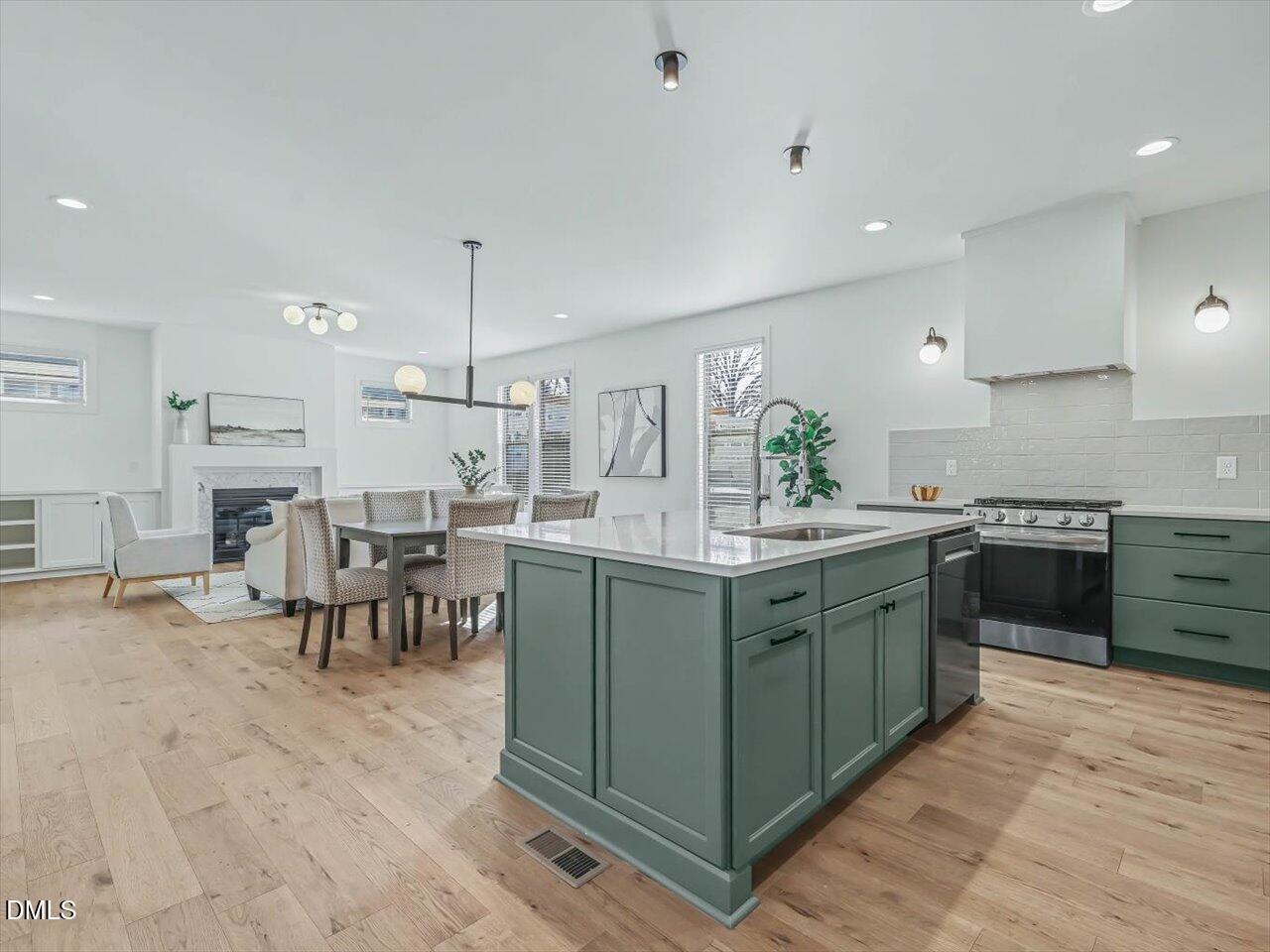 2312 Broad Street Durham, NC 27704 - Photo 8 of 53 a kitchen with lots of counter top space and dining table