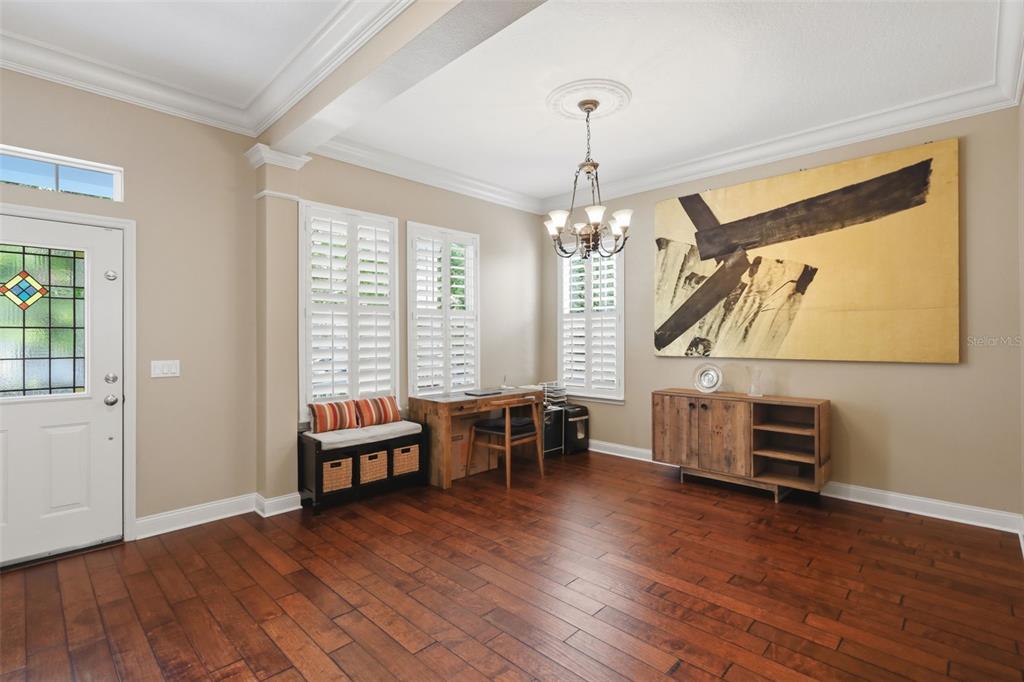907 Pawstand Road Celebration, FL 34747 - Photo 9 of 49 a view of a room with furniture and wooden floor