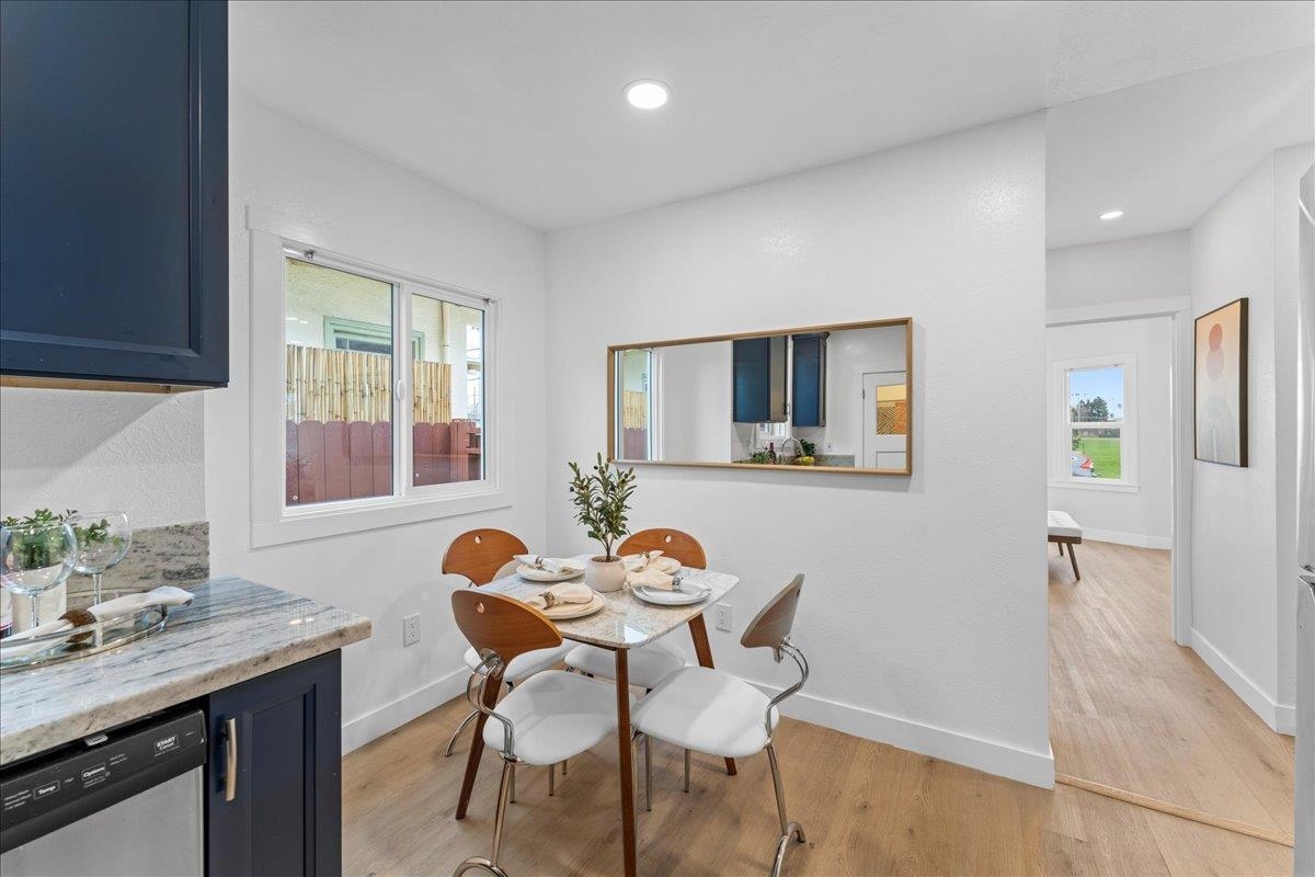 2717 Mabel Street Berkeley, CA 94702 - Photo 17 of 59 Dining room featuring light wood-style flooring and baseboards