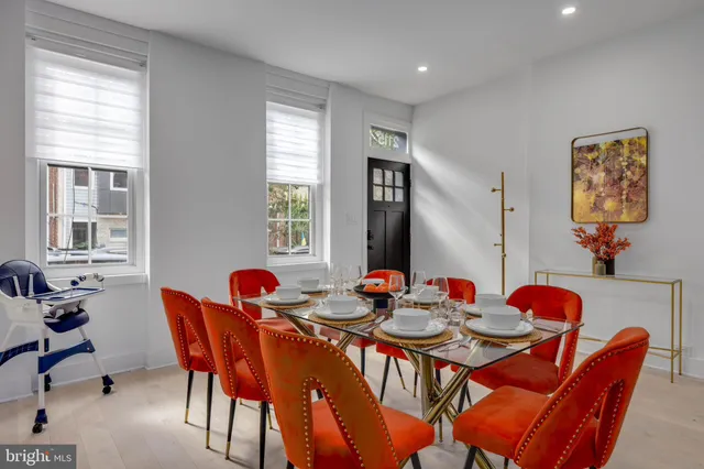 a dining room with furniture and window