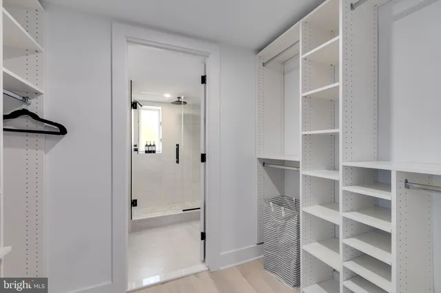 a bathroom with a glass shower door