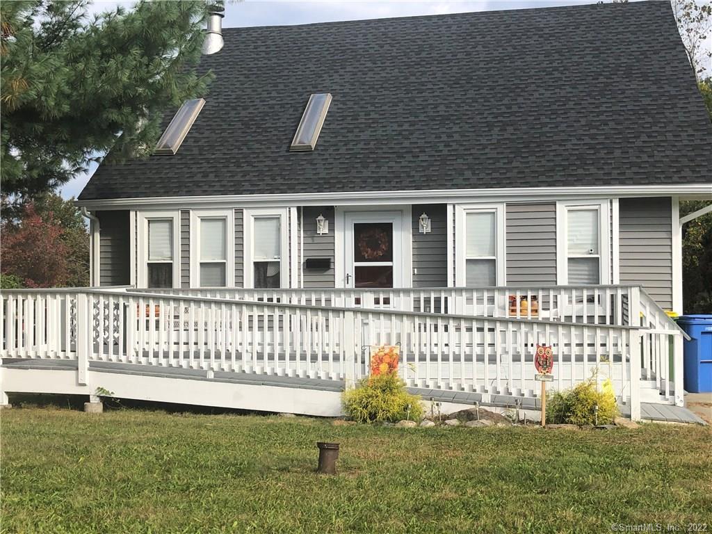 60 Chipper Road Waterbury, CT 06704 - Photo 1 of 1 a front view of a house with a garden