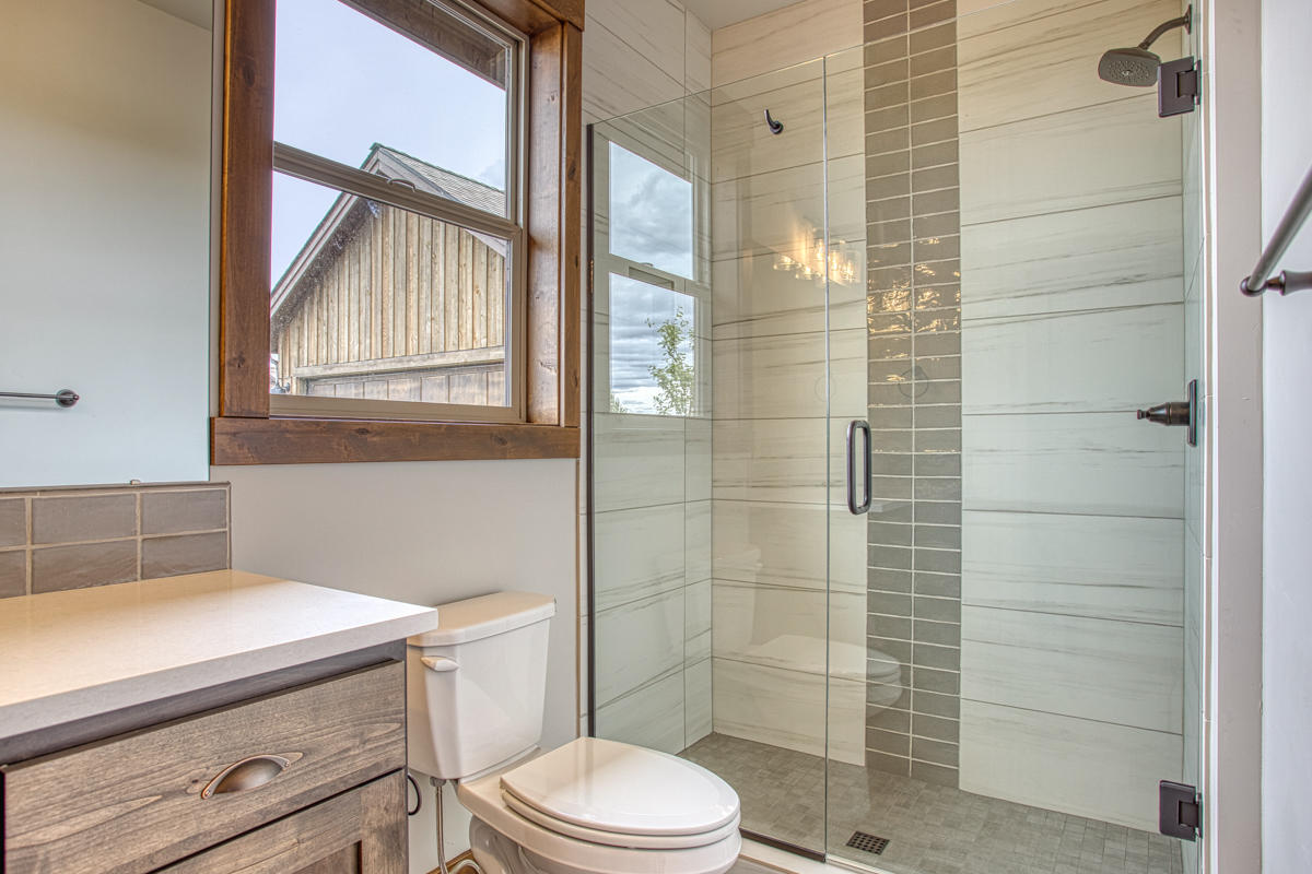 15751 South W Brasada Ranch Road, Unit LOT 363 Powell Butte, OR 97753 - Photo 34 of 47 a bathroom with a sink a toilet and shower