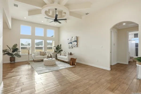 a living room with furniture and a large window