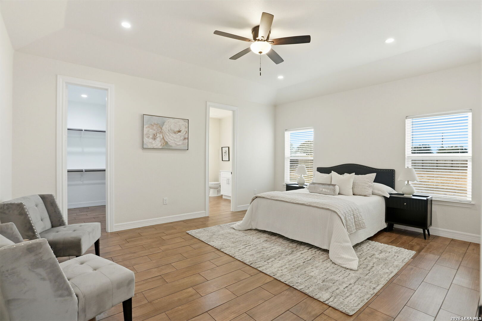 100 West Short Meadow Drive Lytle, TX 78052 - Photo 25 of 51 a bedroom with a large bed and a couch