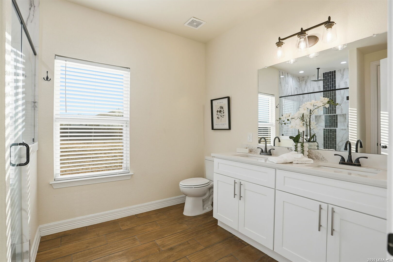 100 West Short Meadow Drive Lytle, TX 78052 - Photo 27 of 51 a bathroom with a toilet sink and mirror