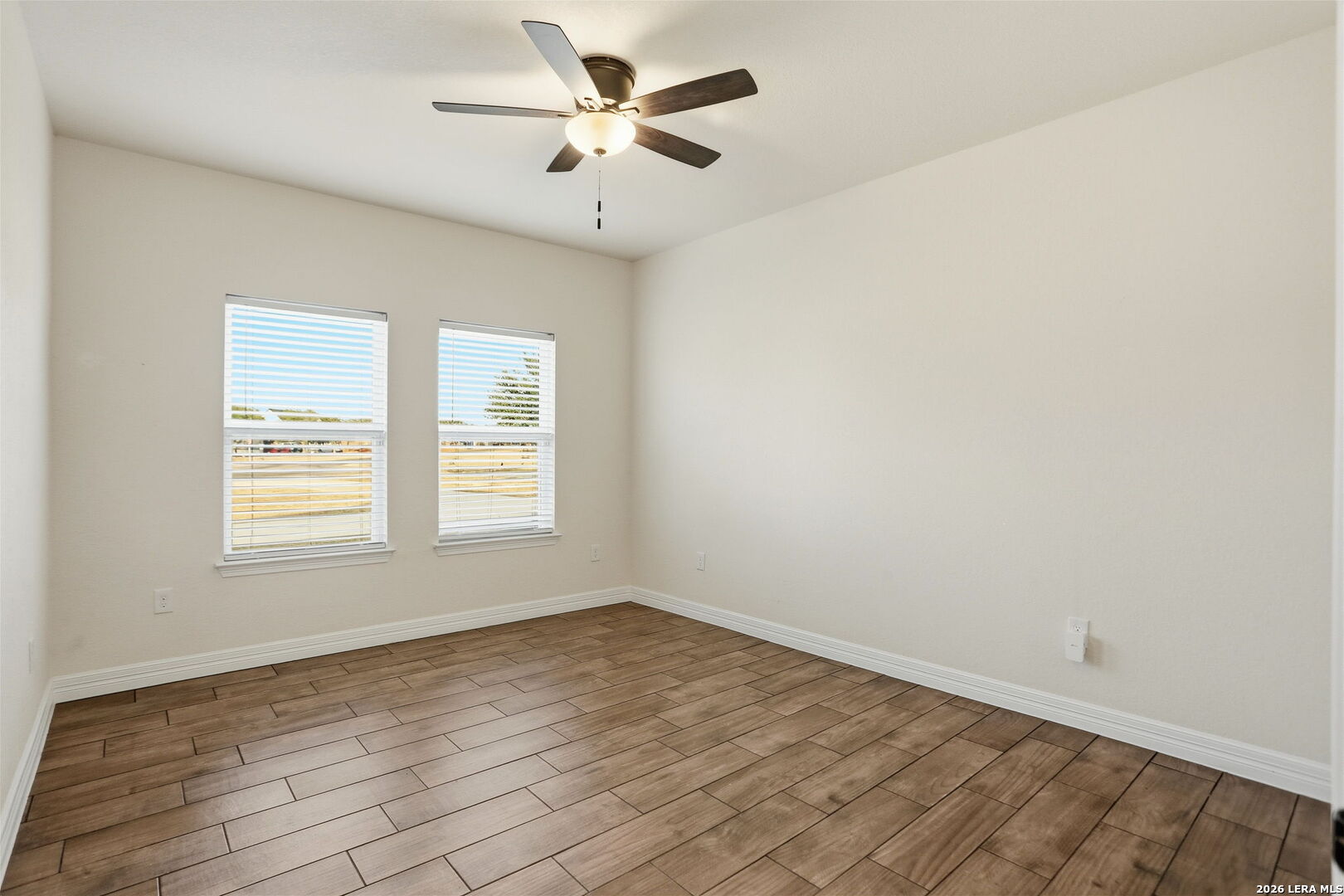 100 West Short Meadow Drive Lytle, TX 78052 - Photo 32 of 51 an empty room with a window and a fan