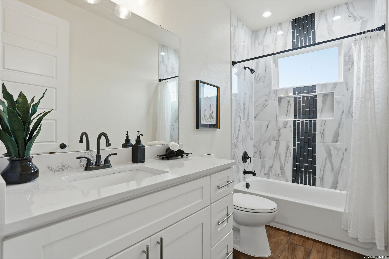 100 West Short Meadow Drive Lytle, TX 78052 - Photo 35 of 51 a bathroom with a double vanity sink toilet and shower