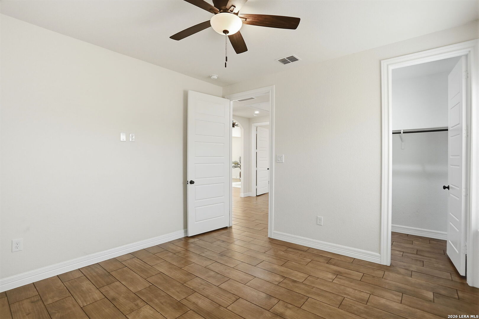 100 West Short Meadow Drive Lytle, TX 78052 - Photo 37 of 51 a view of an empty room and wooden floor