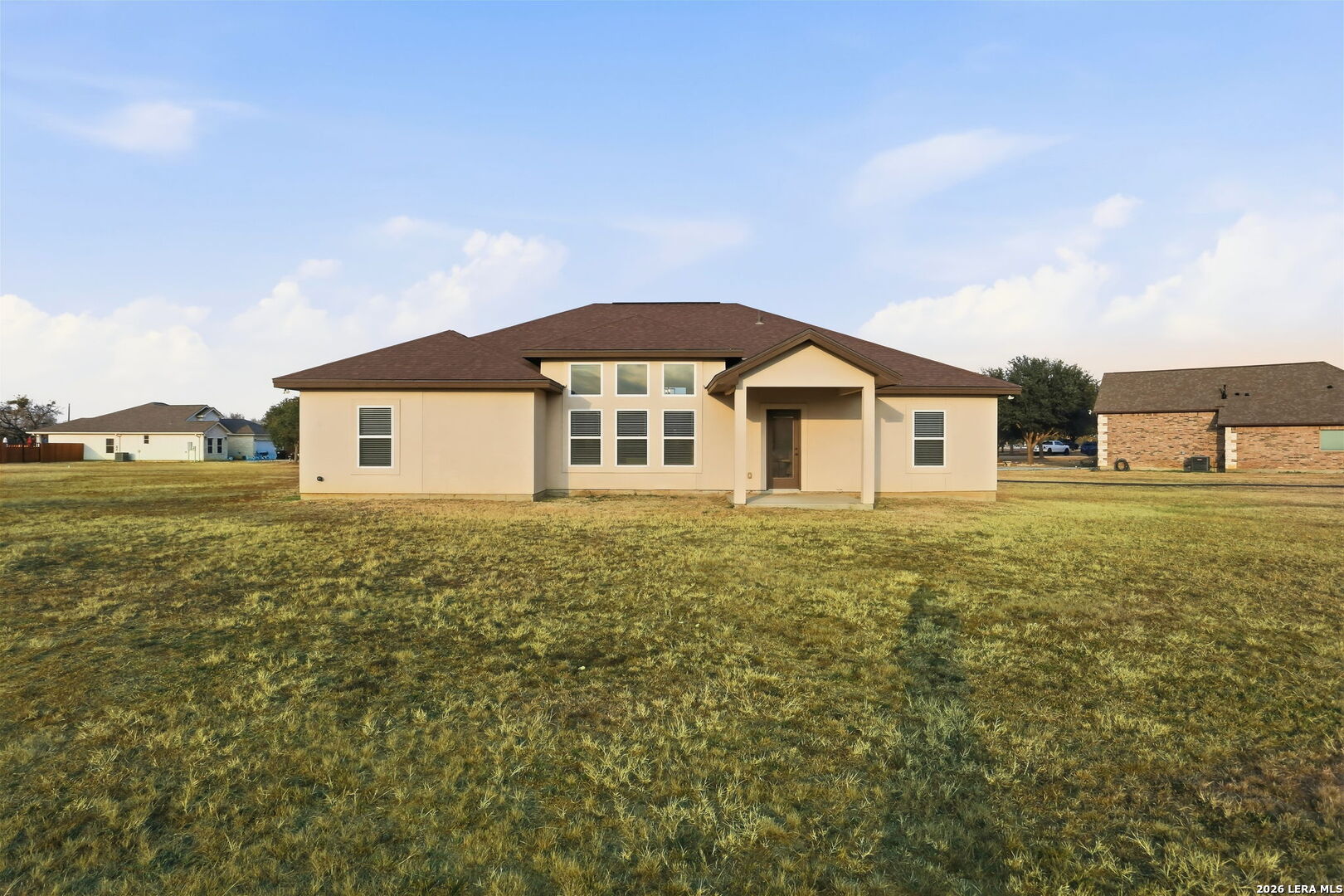 100 West Short Meadow Drive Lytle, TX 78052 - Photo 43 of 51 a view of a house with a yard