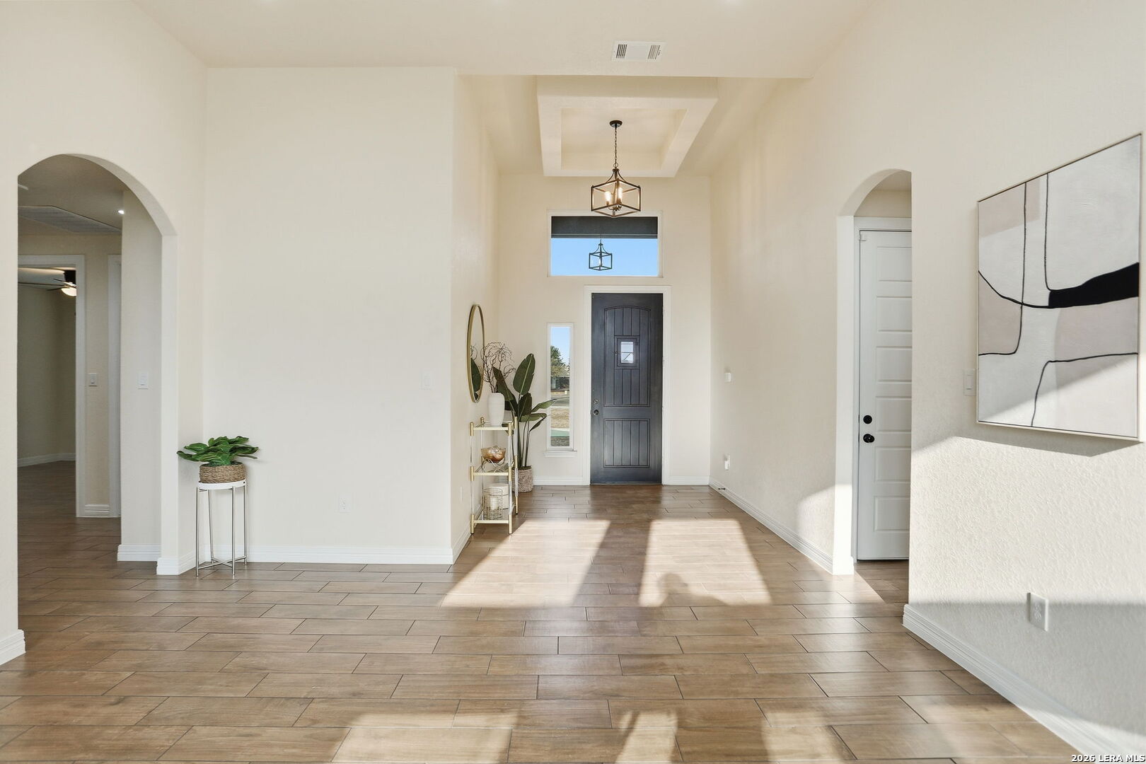 100 West Short Meadow Drive Lytle, TX 78052 - Photo 9 of 51 a view of an entryway with wooden floor and a livingroom view