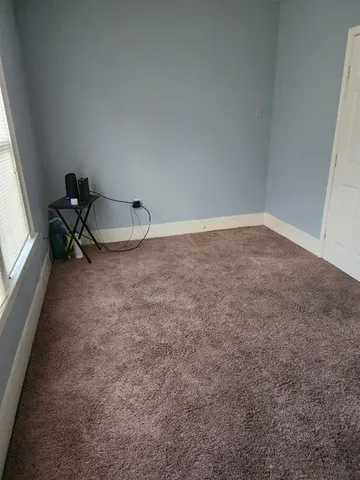 a very nice looking room with a chair and a window