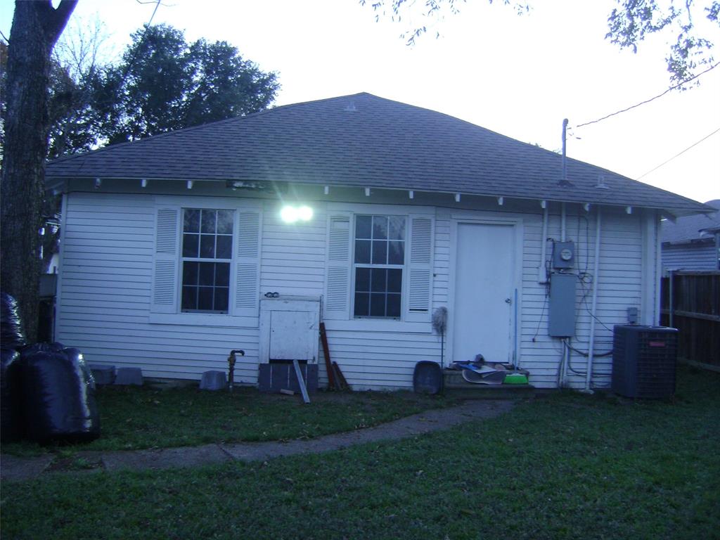 2419 Catherine Street Dallas, TX 75211 - Photo 3 of 12 a front view of a house with a garden